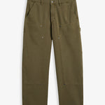 A front view of The Carpenter Pant in olive green, laid flat on a white background. The image highlights the front slash pockets, reinforced knee panels with rivets, and the embroidered c'est normal logo.