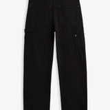 A back view of The Carpenter Pant in black, laid flat on a white background. The image highlights the two back pockets, a hammer loop, side leg pockets, and a c'est normal logo patch on the back right pocket.