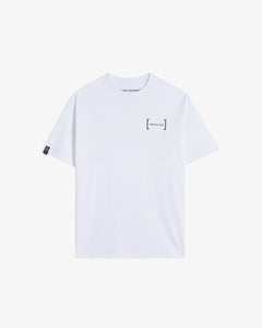 A front view of Le T-Shirt in white, laid flat on a white background. The image highlights the classic ribbed collar, the black FRC Edition mirror logo on the chest, and the signature black satin cuff tag with gold print from c'est normal.