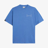 Le Linen T-Shirt in azure — front view with an embroidered chest logo