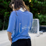 Le Linen T-Shirt in Azure — back view with French Riviera Club graphic by a classic car