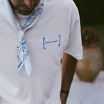Le Linen T-Shirt in white — blue C'est normal embroidery and a patterned bandana