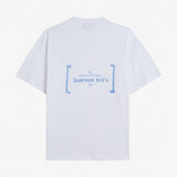 Le Linen T-Shirt in white — back view with blue C'est normal French Riviera Club graphic