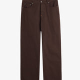 A front view of The 5 Pocket Pants in brown, laid flat on a white background. The image highlights the five-pocket design, zip fly, top button, and touches of orange accent stitching.
