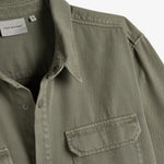 The Bilbao Overshirt in olive — detail of the collar and buttoned chest pocket