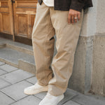 The Chamonix Chino in khaki beige — worn with white sneakers