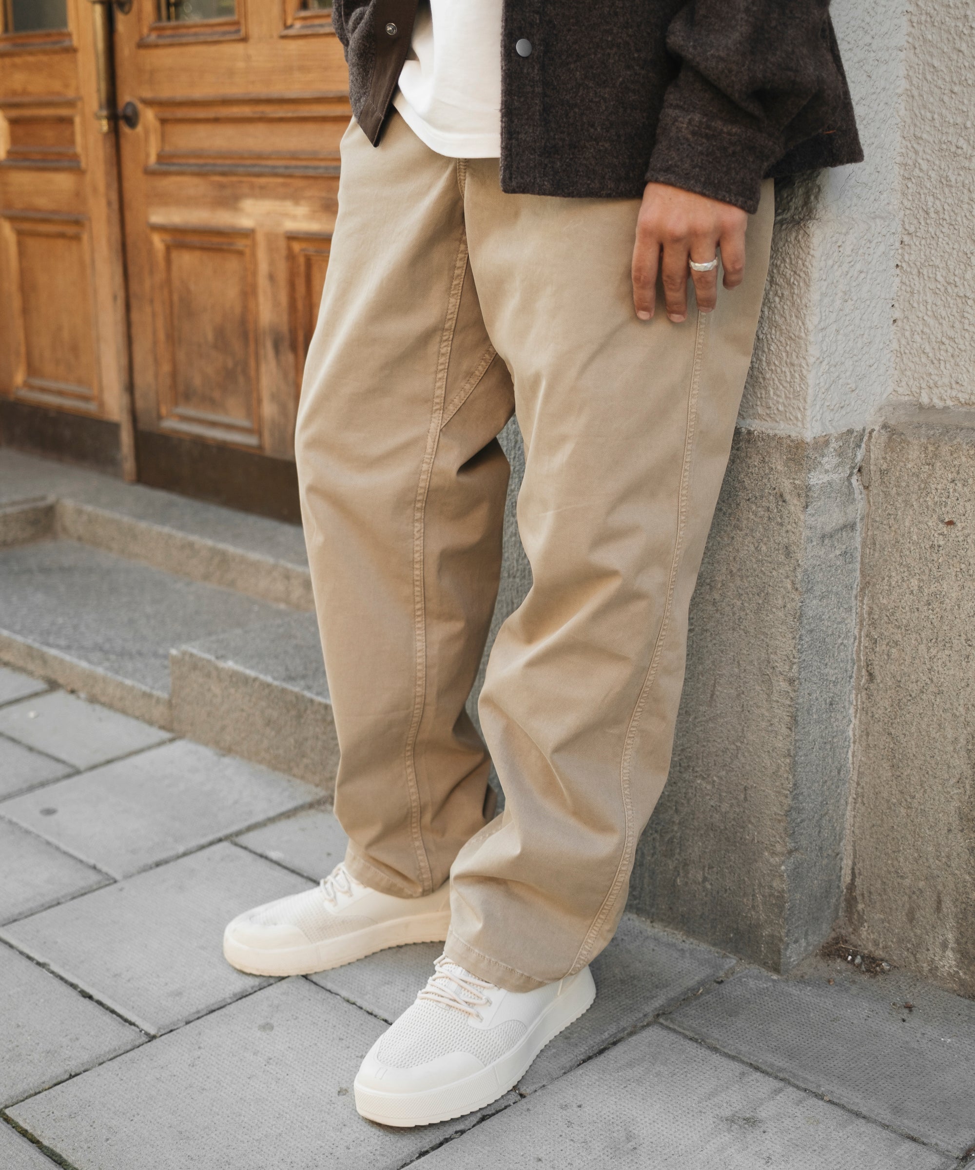 The Chamonix Chino in khaki beige — worn with white sneakers