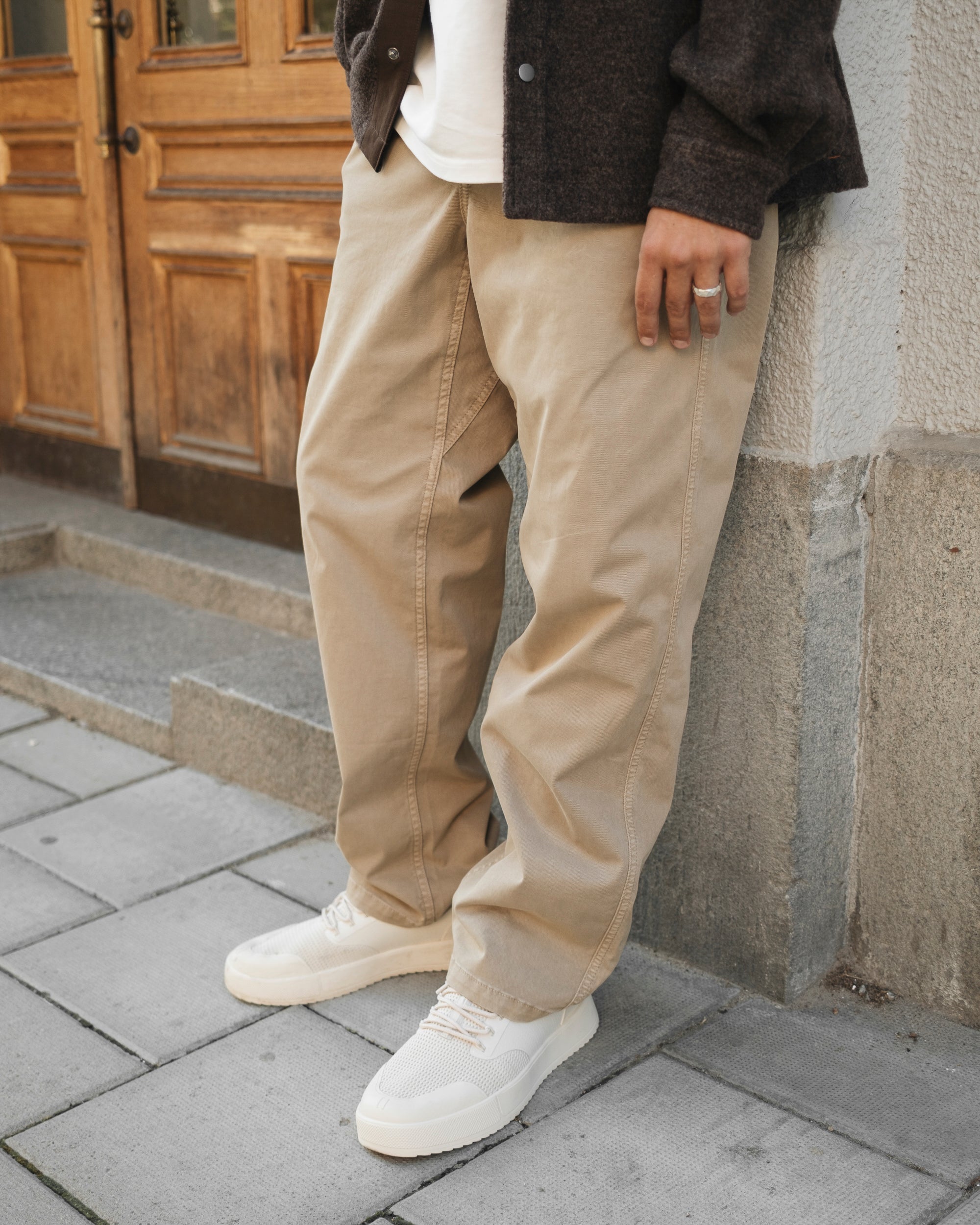 The Chamonix Chino in khaki beige — worn with white sneakers