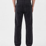 The Daily Cord Chino in anthracite grey — back view showing buttoned rear pockets