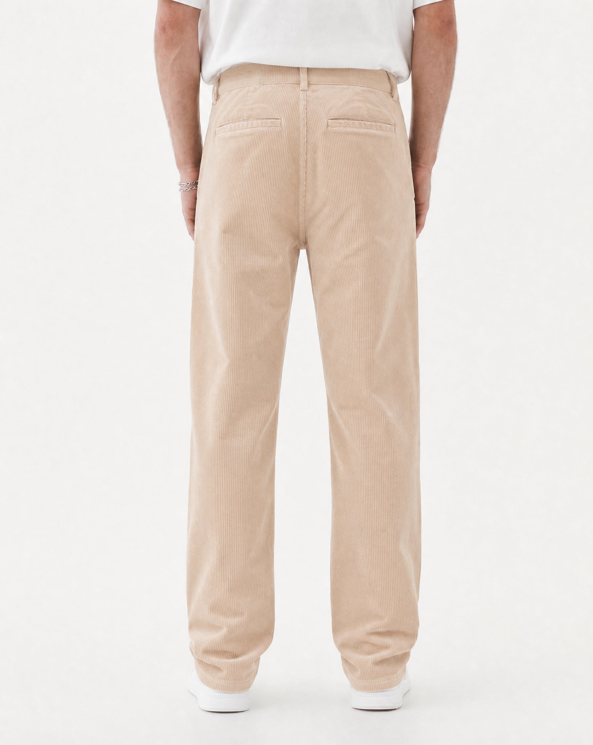 The Daily Cord Chino in Irish Cream — back view showing buttoned rear pockets