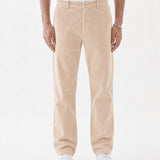 The Daily Cord Chino in irish cream — front view worn with a white t-shirt