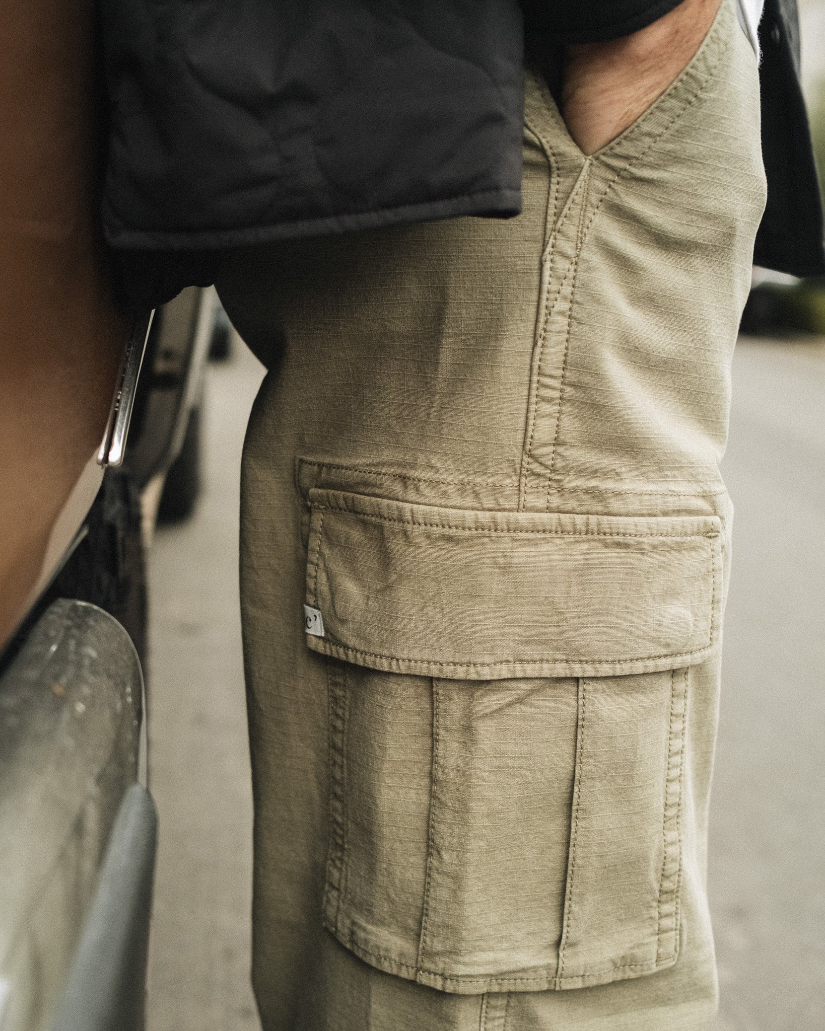 The Monterey Cargo Pant in light khaki — close-up of the side cargo pocket and ripstop fabric