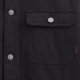 Denver Canvas Jacket in black — close-up of the chest pocket and metal buttons