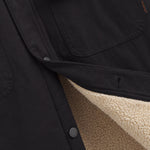 Denver Canvas Jacket in black — close-up of the canvas texture and fleece lining