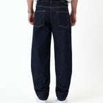 The Jeans Relaxed Straight Fit in rinse wash — back view with the black C'est normal rubber patch