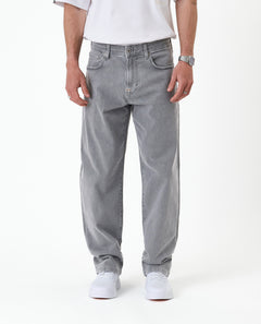 The Jeans Relaxed Straight Fit in light grey — front view worn with white sneakers