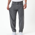 The Jeans Relaxed Straight Fit in light grey — showing the stretch of the fabric
