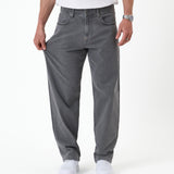 The Jeans Relaxed Straight Fit in light grey — showing the stretch of the fabric