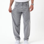 The Jeans Relaxed Straight Fit in light grey — demonstrating fabric stretch