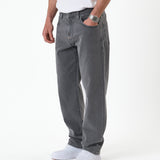 The Jeans Relaxed Straight Fit in light grey — worn with white sneakers