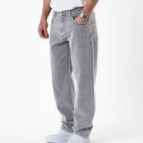 The Jeans Relaxed Straight Fit in light grey — worn with white sneakers