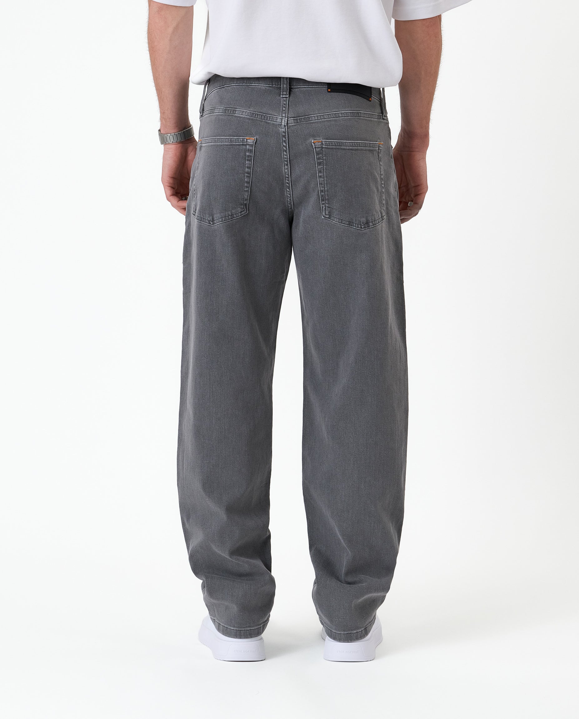 The Jeans Relaxed Straight Fit in light grey — back view showing the straight leg silhouette