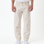 The Jeans Relaxed Straight Fit in ecru — front view worn with white sneakers