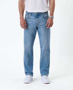 The Jeans Classic Straight Fit in light mid blue — front view worn with white sneakers