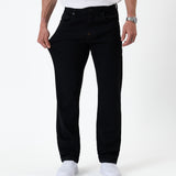 The Jeans Classic Straight Fit in jet black — showing the stretch of the denim fabric