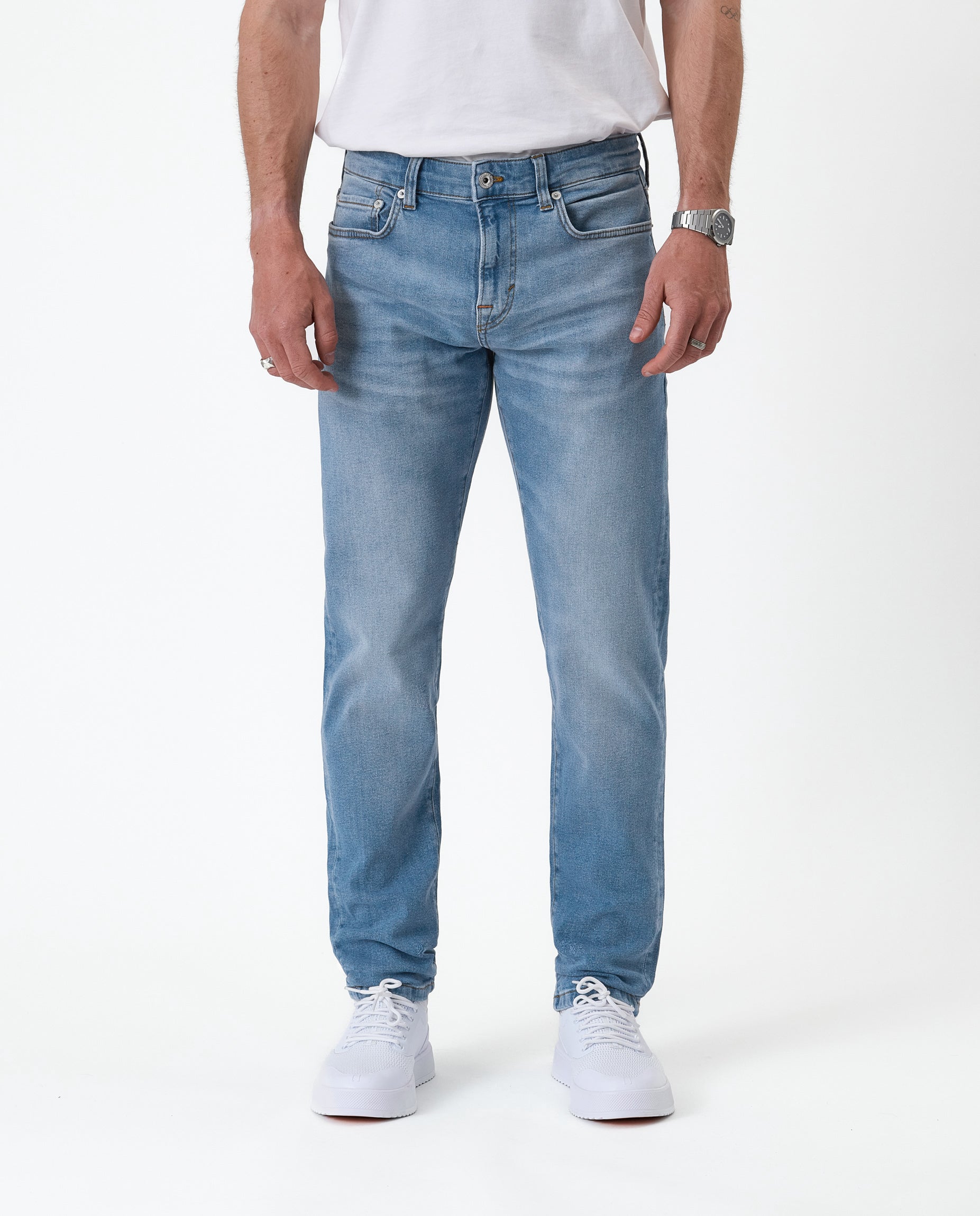 The Jeans Slim Fit in light midwash — front view against a white background