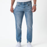 The Jeans Slim Fit in Light Midwash — showing the stretch of the Motion Fabric