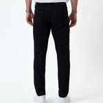 The Jeans Skinny Fit in jet black — back view showing the skinny silhouette