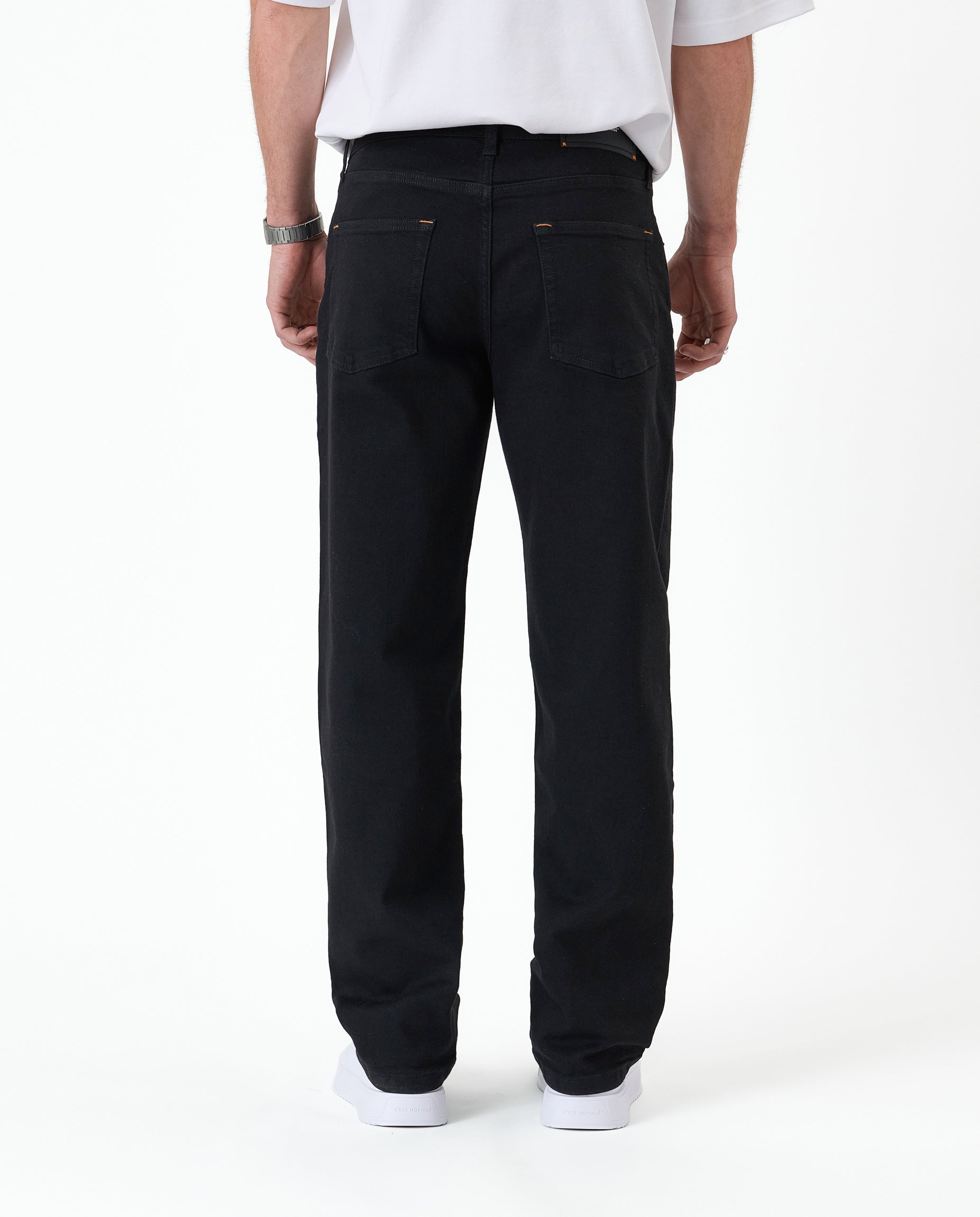 The Jeans Relaxed Straight Fit in Jet Black — back view showing the straight leg silhouette
