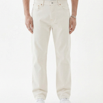 The Jeans Relaxed Straight Fit in ecru — front view worn with white sneakers