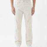 The Jeans Relaxed Straight Fit in ecru — front view worn with white sneakers
