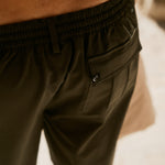The Board Shorts in khaki — close-up of the side cargo pocket and elastic waistband