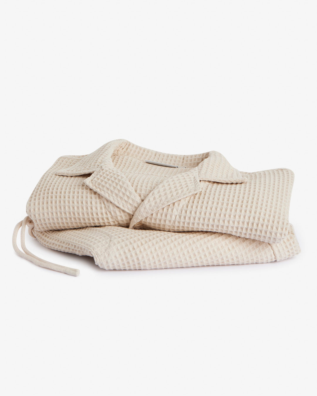 Le Waffle Resort Shirt in light beige — folded to show the waffle-woven texture