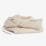Le Waffle Resort Shirt in light beige — folded to show the waffle-woven texture