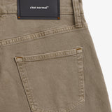 Motion 5 Pocket Classic Straight Pant in khaki — close-up of the back pocket and rubber patch
