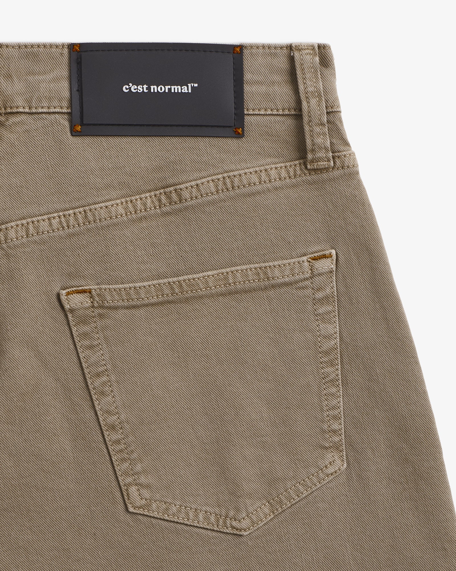 Motion 5 Pocket Classic Straight Pant in khaki — close-up of the back pocket and rubber patch