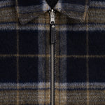 The Reversable Wool Jacket in dark plaid — closeup of the front zipper and collar