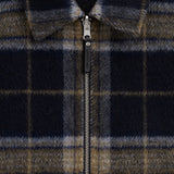 The Reversable Wool Jacket in dark plaid — closeup of the front zipper and collar