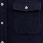 Stockholm Wool Shacket in blue — close-up of the chest pocket and button details