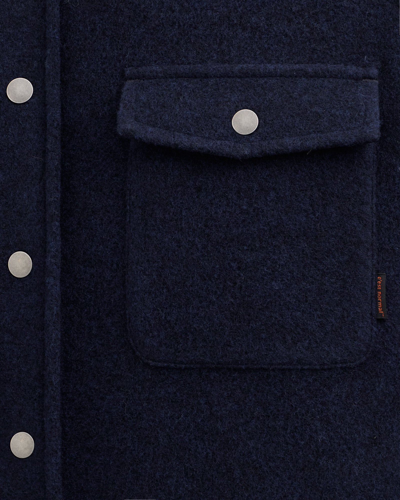 Stockholm Wool Shacket in blue — close-up of the chest pocket and button details