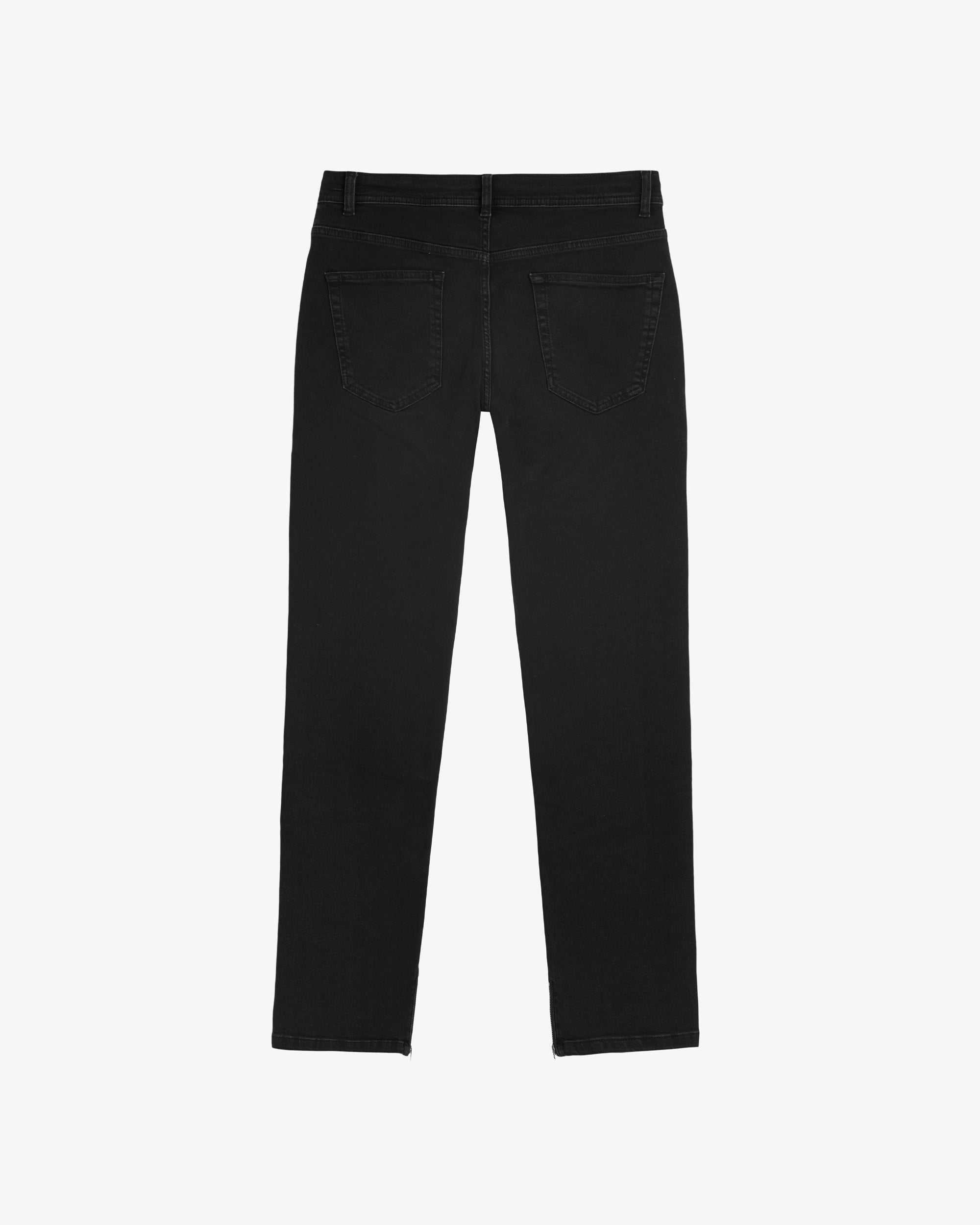 A back view of The Jeans Regular Fit in black, laid flat on a white background. The image highlights the two back pockets and waistband.