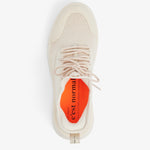 A top-down view of The Sneaker 2.0 in Cream, laid out on a white background. The image highlights the tone-on-tone mesh upper, laces, and the bright orange insole featuring the black c'est normal logo and text.