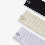 The Sock Multicolor 3-Pack in black, cream, and white — C'est normal logo on the ribbed cuffs