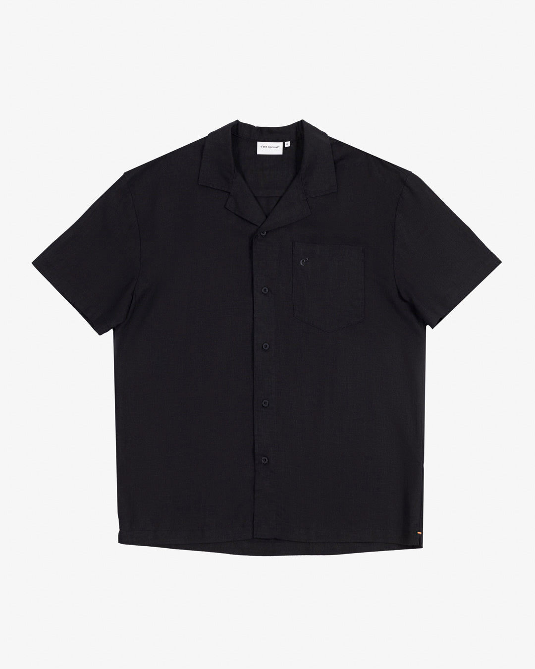 The Linen Resort Shirt in black — flat lay front view with a camp collar and chest pocket