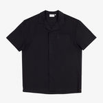 The Linen Resort Shirt in black — flat lay front view with a camp collar and chest pocket