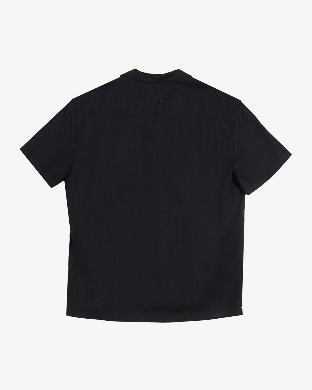 The Linen Resort Shirt in black — back view showing the logo embroidered on the yoke